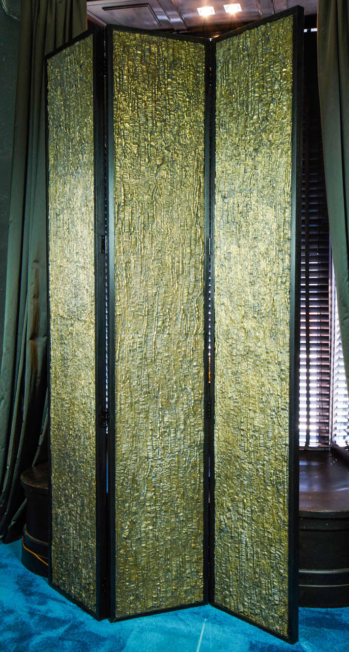 Wood structure resin and brass powder panels in one side, grey silk wall paper on the other side.