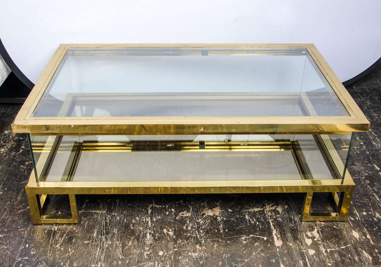 1960's Italian rectangular coffee table in brass, glass and mirror with a sliding top in style of Romeo Rega.