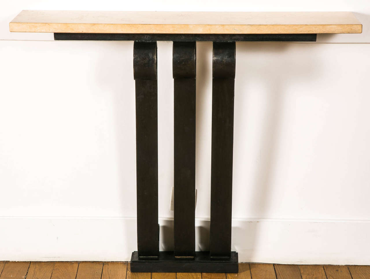 Wrought iron Art Deco console with a rectangular beige marble top, France, 1930s.
Three-part base with double volutes.