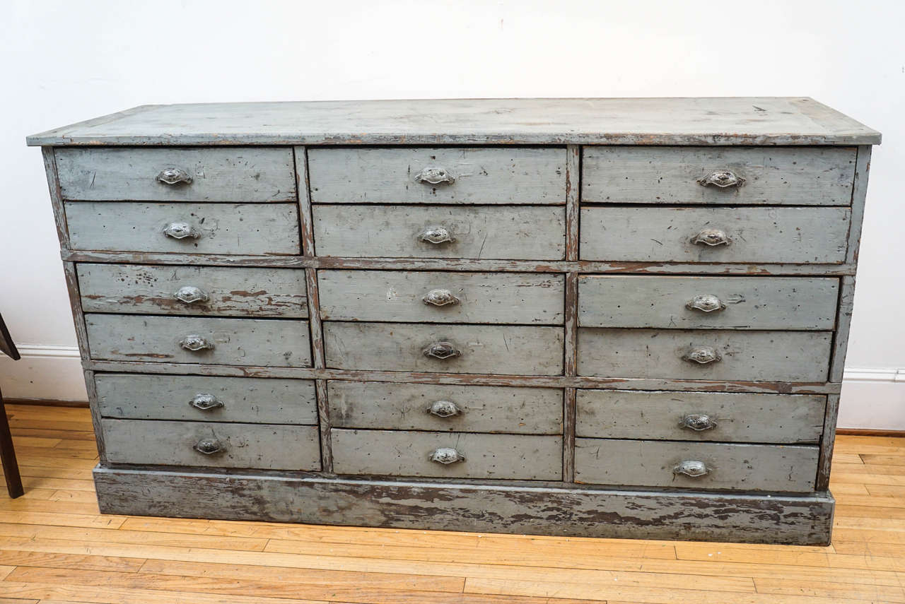 This worn, original painted dresser base has a soft grey color and metal pulls which are also original. It's clear that we, at painted porch are addicted to multi drawer pieces, particularly if they are useful and this piece certainly is. It is a