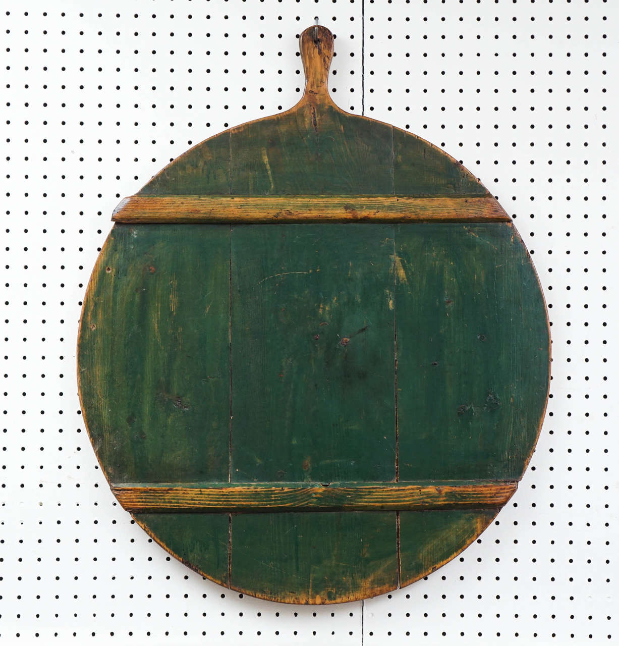 This English Peel board was used in England to peel potatoes. One side is in original stunning green paint and the other side is a rich pine. The runners on the painted side were used to give a sturdy surface while peeling. these pieces look great