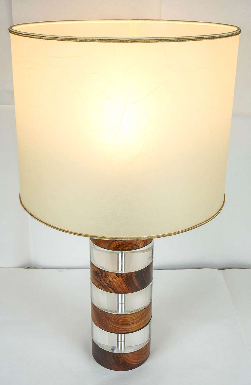 Representative of the 1960s era pair of cylindrical lamps consist of alternating wood and plexiglass (Lucite.)
Price is for two.
The measure are with the shade (that is new.)
   