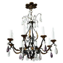 An eight light iron chandelier with shallow dish