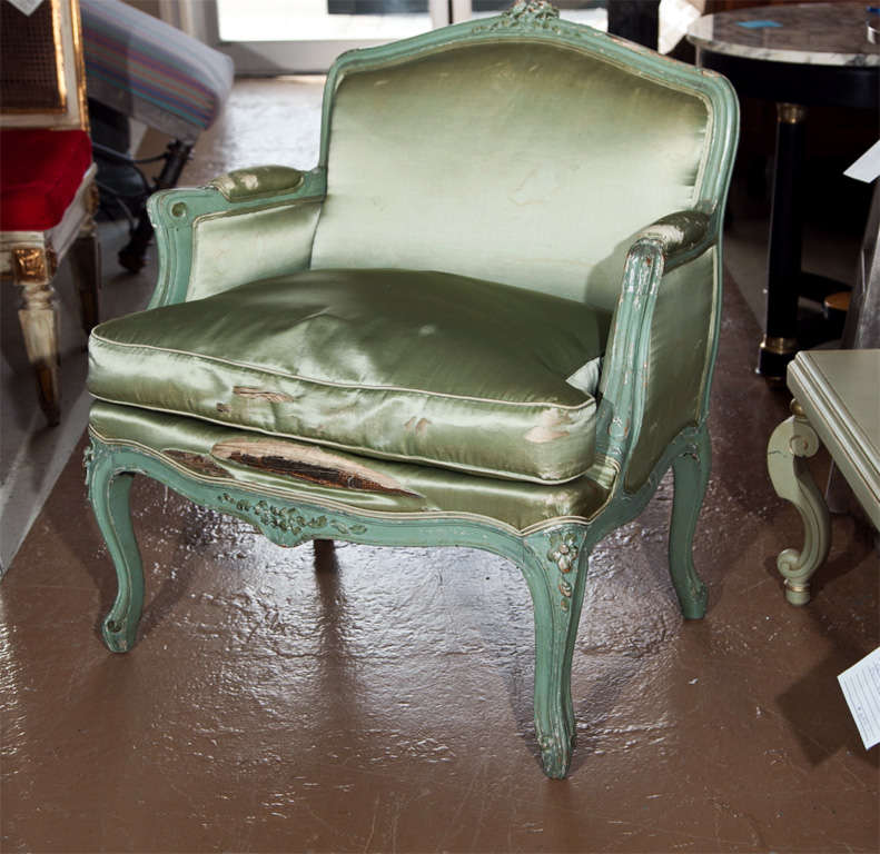 French Louis XV style green distress painted child's bergere chair. The fabric is in need of changing.