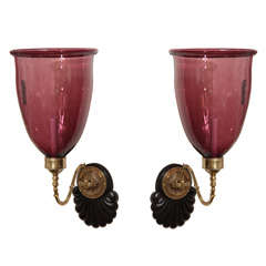pair of stunning sconces with jewel colored amethyst glass globe