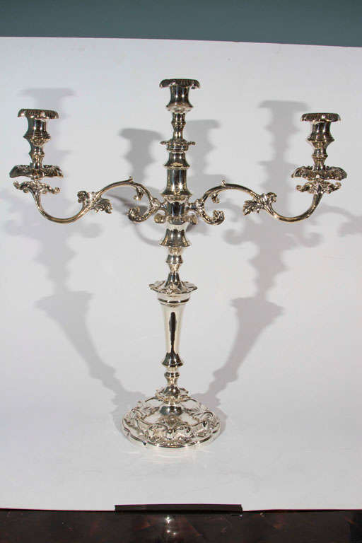Pair of antique brass candelabras with new silver plate.