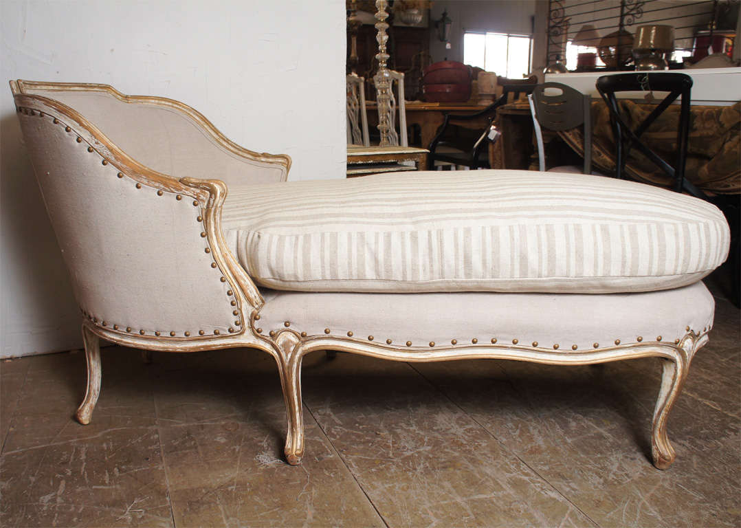 A 19th C.  French Louis XV style chaise longues with gilt and painted frame.  Newly upholstered in canvas and Belgium linen.