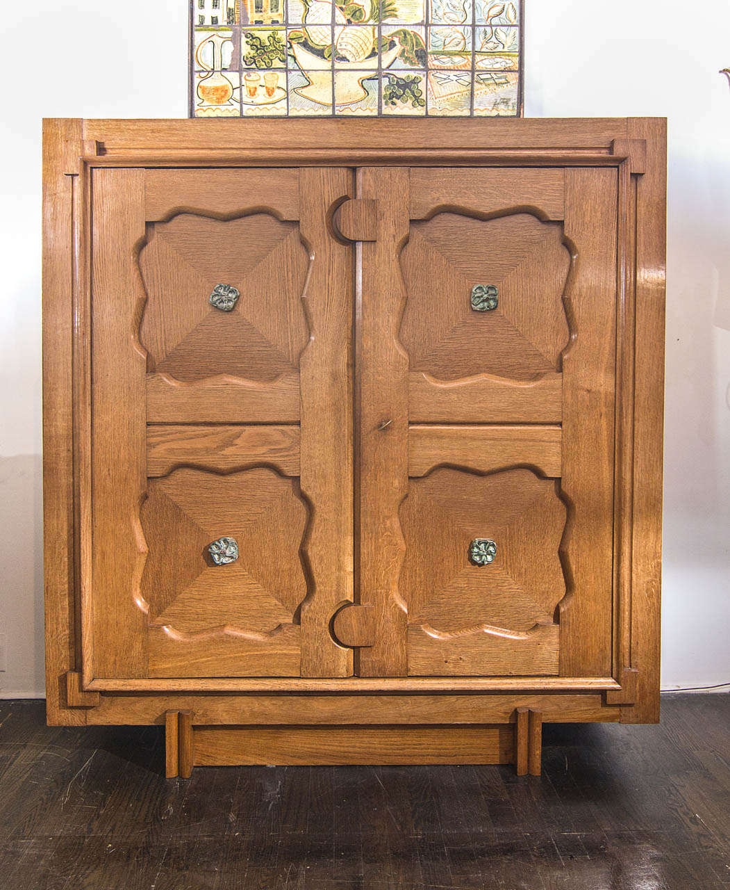 Tall oak cabinet with decorative tiles by Guillerme et Chambron. France, 1950's