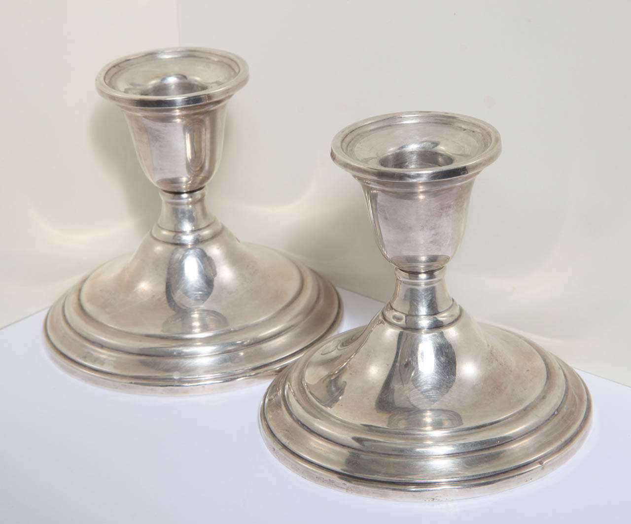The International Weighted Sterling Silver Candle Holders are classical. Their style is simple and can go in any sitting from Traditional to Contemporary. The hallmark is at the bottom.
