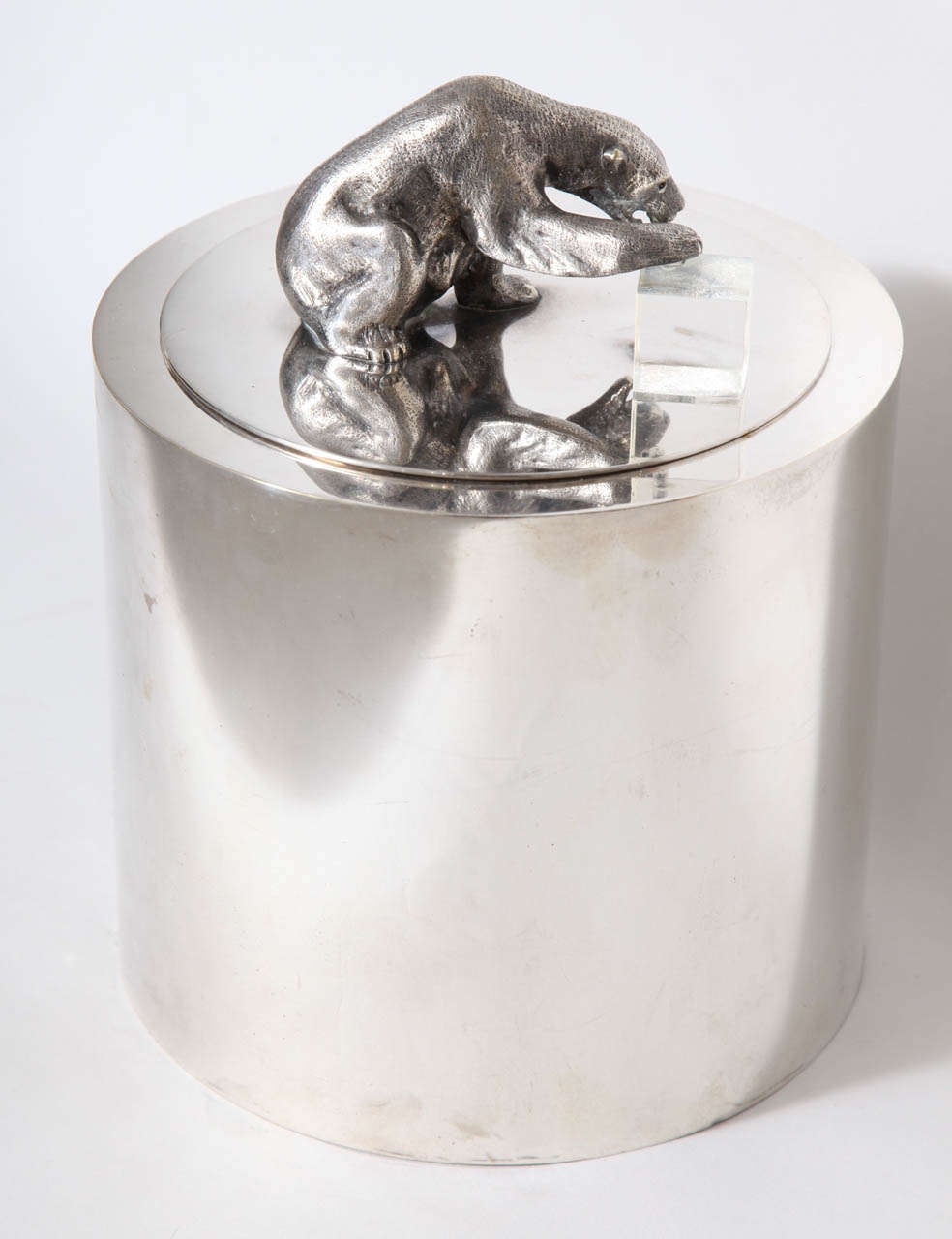 A fabulous nickel plated ice bucket with nickel plated bear protecting a lucite ice cube. Designed by Gabriella Crespi with retailers stamp (indistinctly)