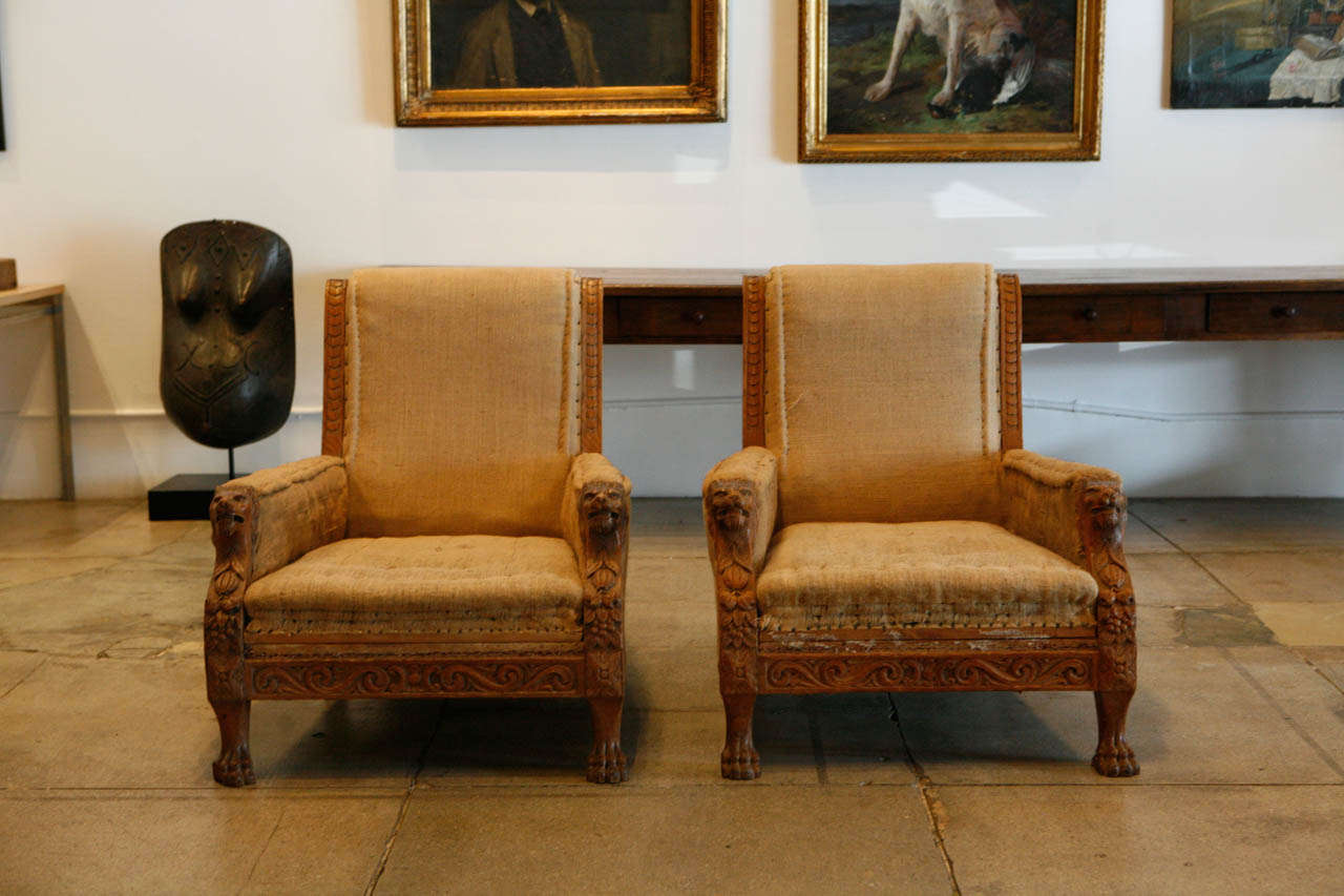 A beautifully handsome pair of English library chairs in beautifully hand-carved English oak frames. *sold only as a pair.