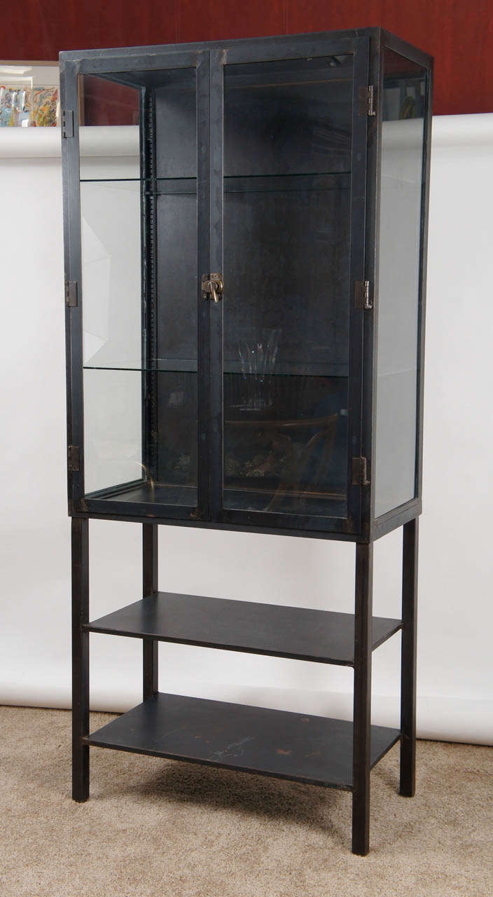 This versatile storage cabinet boasts two glass and three metal shelves. The glass doors allow quick access to contents, which might include towels, sweaters, collections, etc. It looks well in a kitchen, dressing room, bathroom, or anywhere