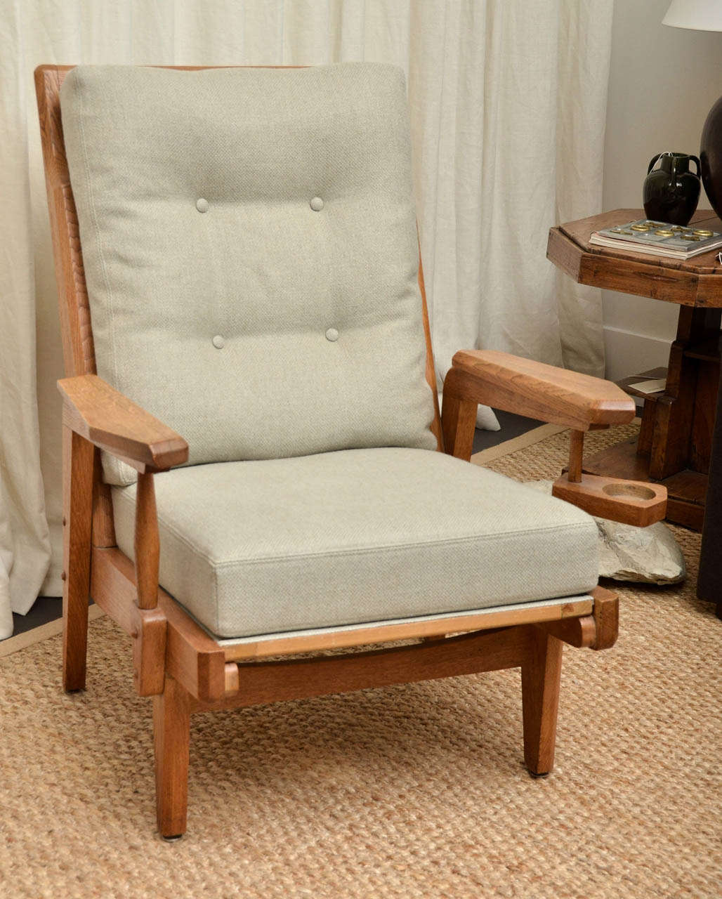 Oak Frame armchair with swivel ashtray detail on one arm.  Newly reupholstered in natural linen with very subtle blue thread woven into the linen.