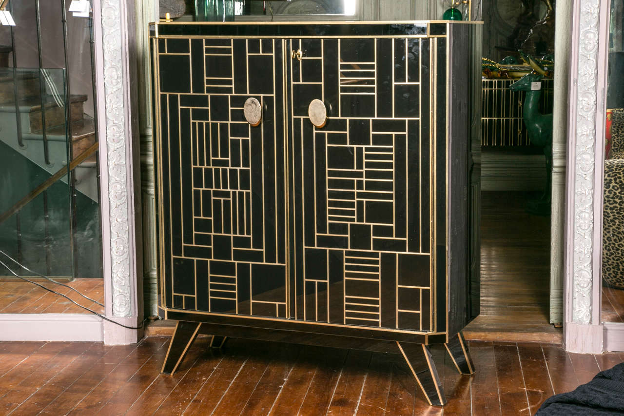 Elegant Black Mirror and Brass Bar