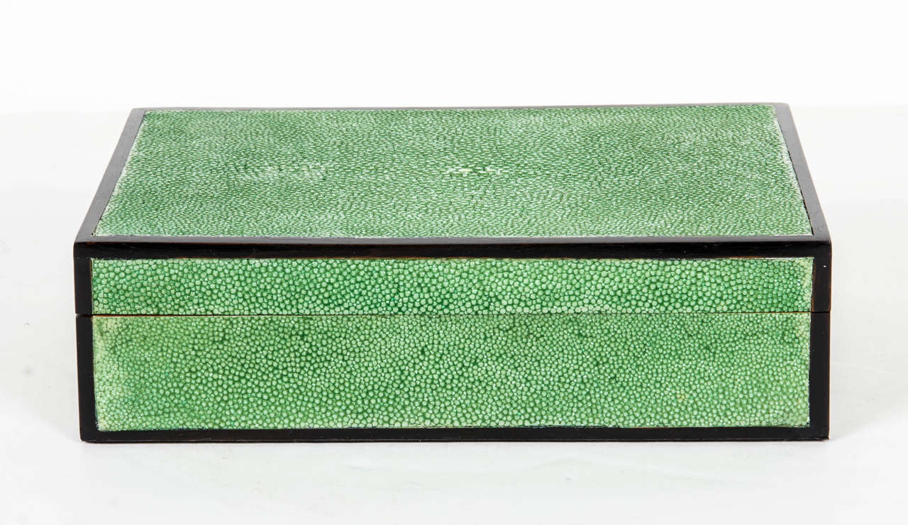Elegant decorative box with detachable lid in beautiful green hued shagreen. The box features ebony wood trim borders, red oak interior and scratch-resistant black velvet bottom. Makes an excellent desk or side table accessory.