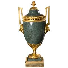 A Bronze Mounted Porphyry Urn