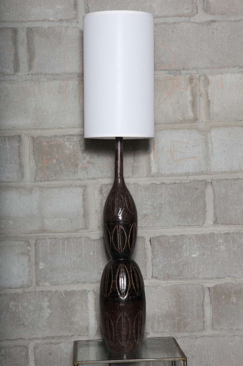 Clever Moroccan lamps with embossed design. Linen shades shown but not included are 10 x 10 x 17, three-way 150 watts or compact florescent, LED ready. Please contact dealer by clicking 