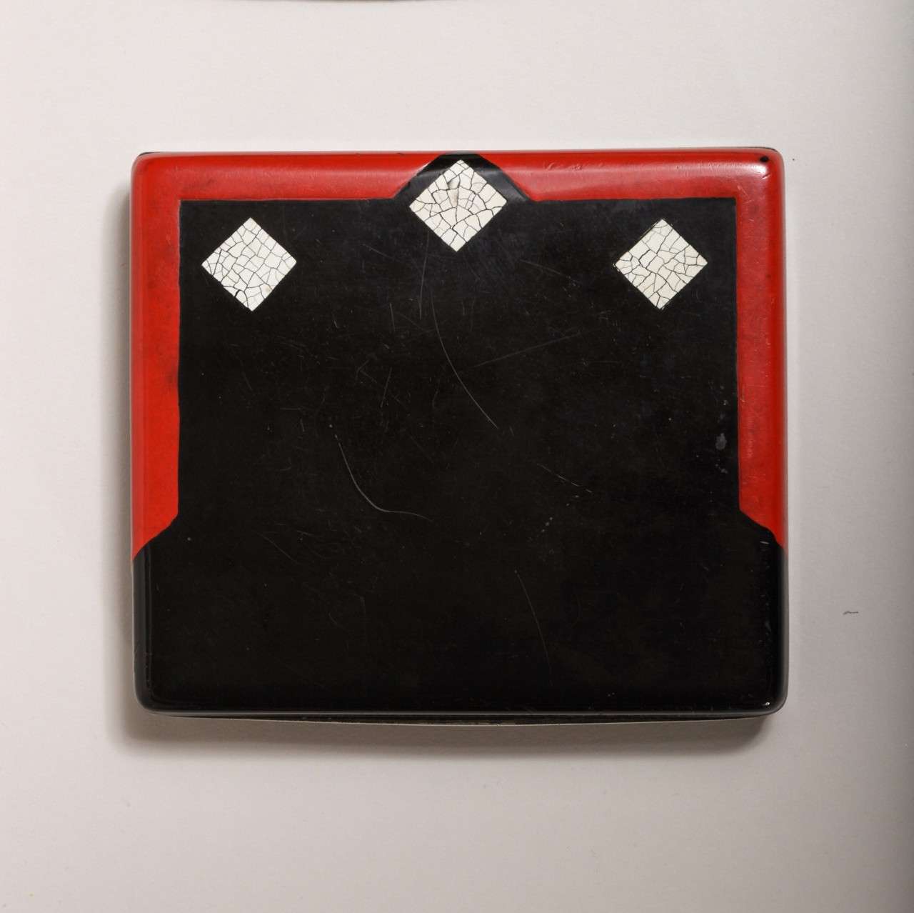 Sterling silver box with black and red enamel and three squares of coquille d'oeuf and with vermeil interior.
Hallmarks: 950 French silver/ RC and eagle with wings spread/ London Import Marks/ 1928/ MN WB
4.60 ozs

Variety of other enamel silver