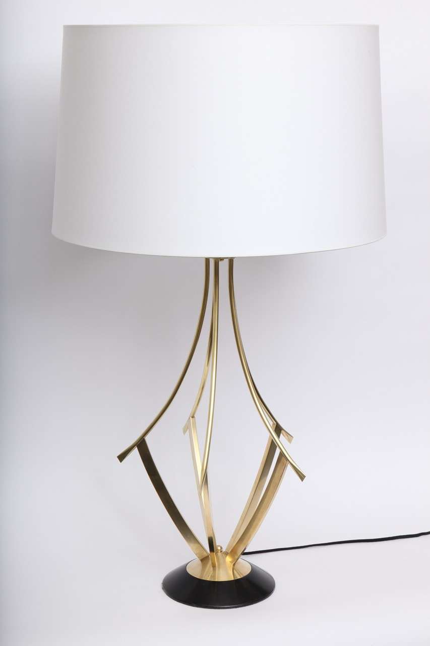 A pair of 1950s Italian sculptural brass table lamp.