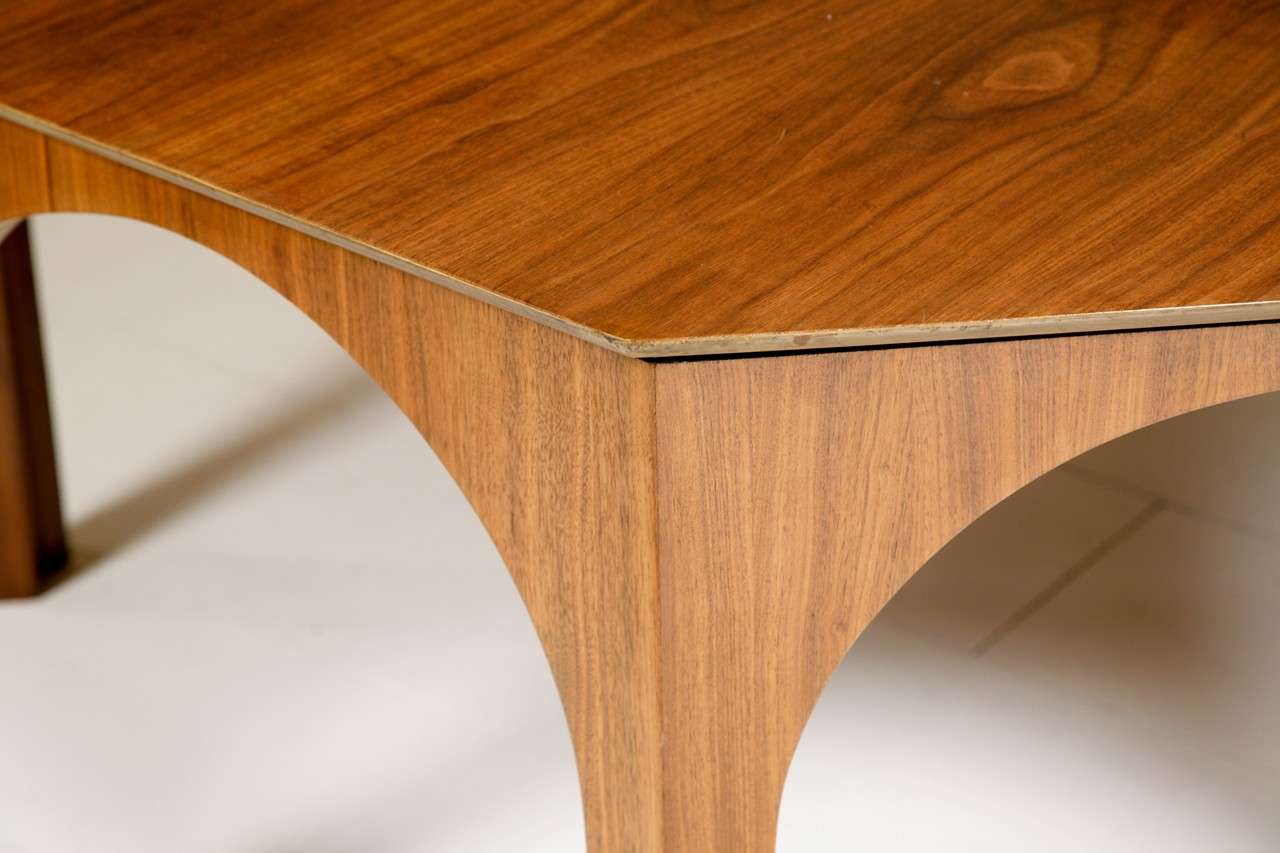 Octagonal walnut veneered Dining/ Centre Table by T H Robsjohn Gibbings, manufactured by Widdicomb, labelled and dated 1956