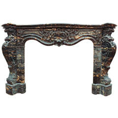 19th C. richly carved Portor marble fireplace