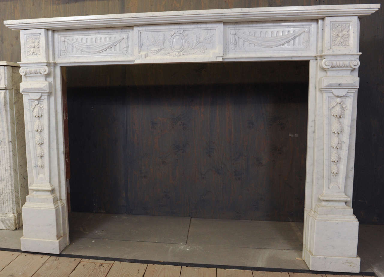 View this item and discover similar architectural elements for sale at 1stdibs - A 19th century French Carrara marble fireplace/mantlepiece in Neoclassical style
