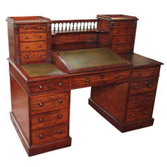 A mid to late 19th Century William IV Carved Mahogany Writing Desk