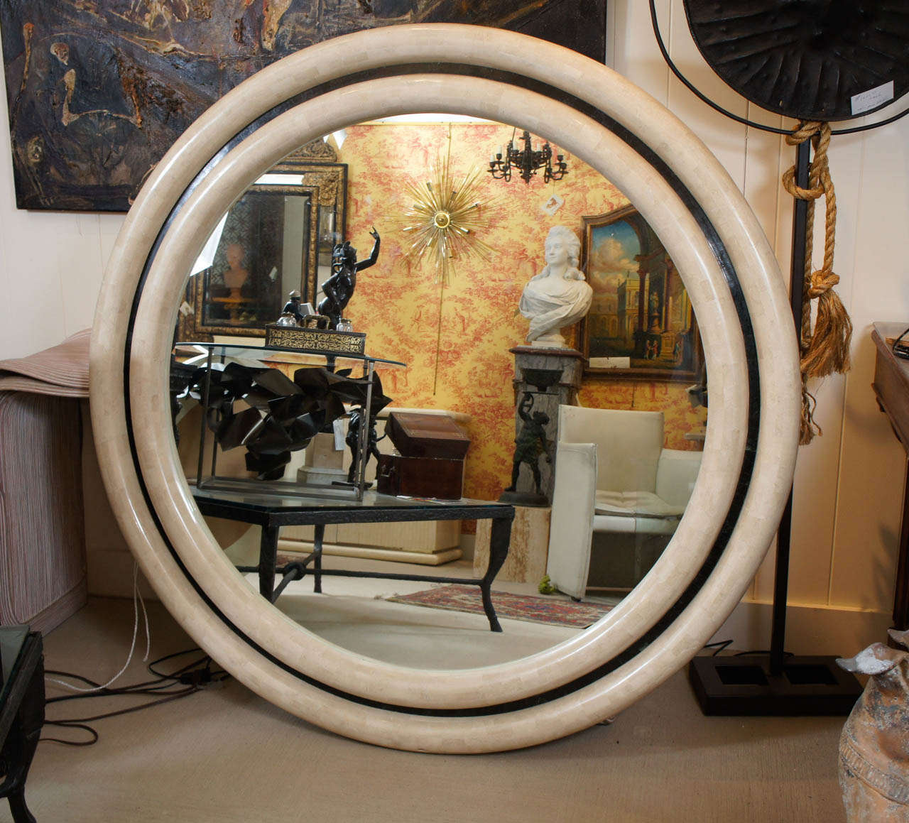 A Large Mirror tesselated with bone in the style of Karl Springer.