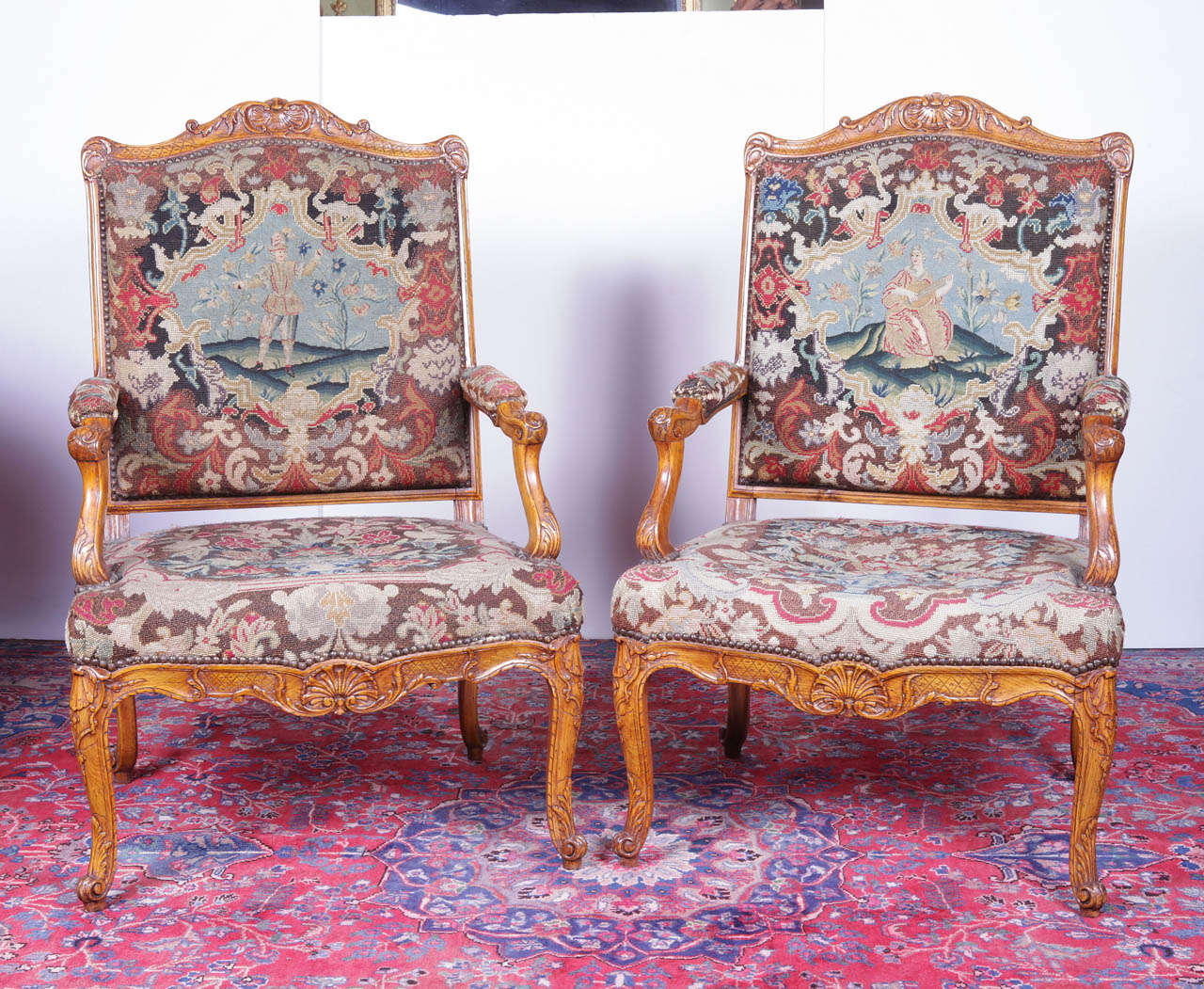 pair of 18th c hand carved Fruitwood hand pegged tapestry chairs. Tapestry mid 19th c