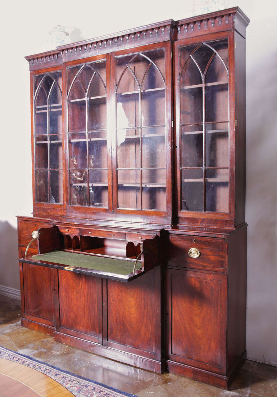 Wood 18th c English George III flame mahogany bookcase with butlers desk For Sale
