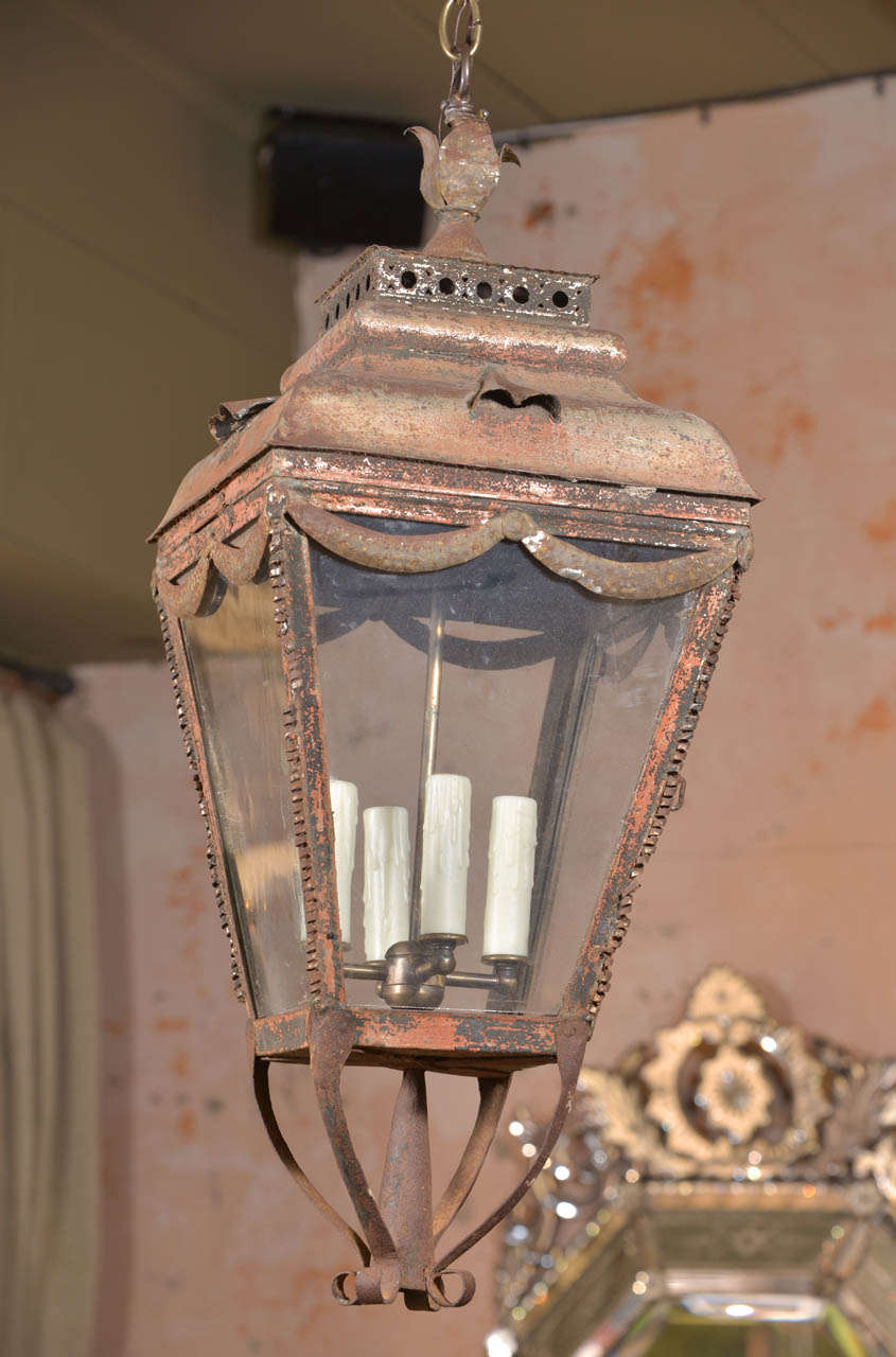 Early French tole lantern with intricate decoration. Traces of paint remain.