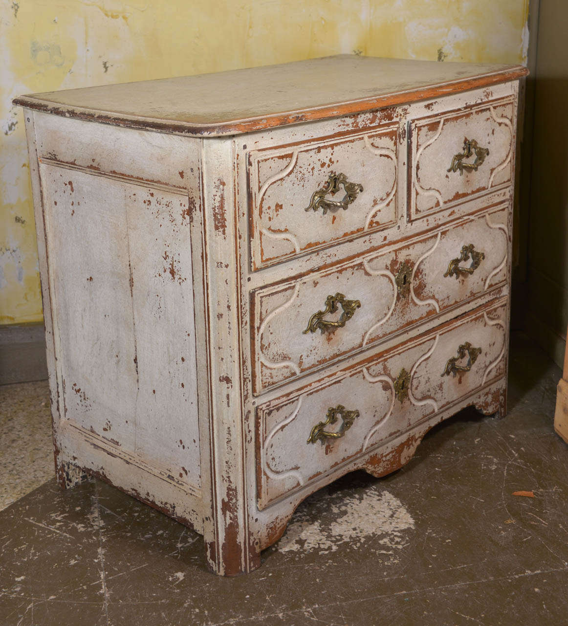 Small scale French Parisian Regence style commode. Great for bedside. In oak with later paint. Original bronze hardware.