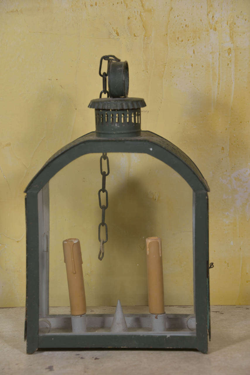 Small French tole lantern with pierced decoration to the top. Pull out tray with two candles. Can be wired.
