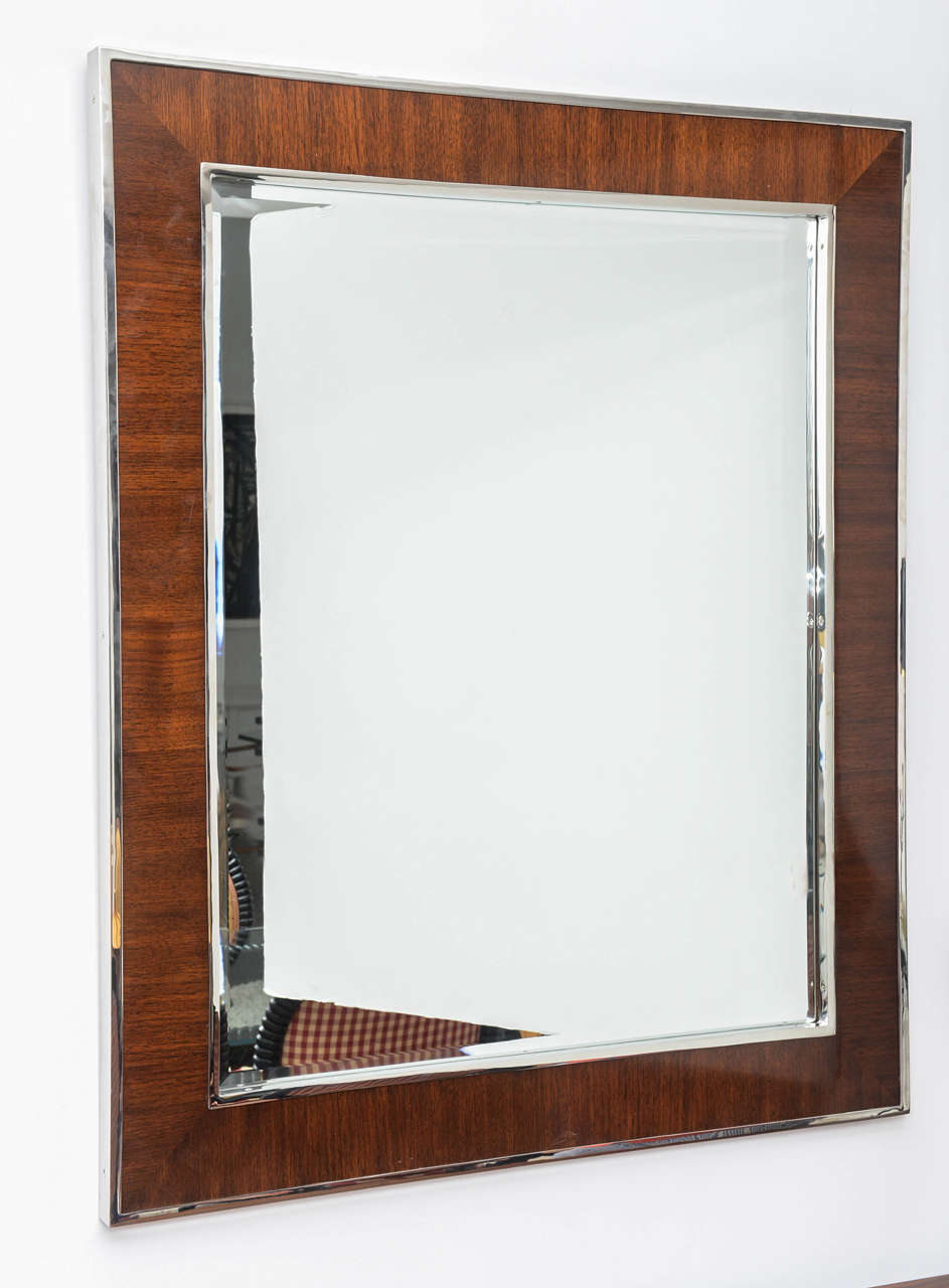This stylish and substantial wall mirror is fabricated in polished chrome and mahogany wood.

Please feel free to contact us directly for a shipping quote or any additional information by clicking 