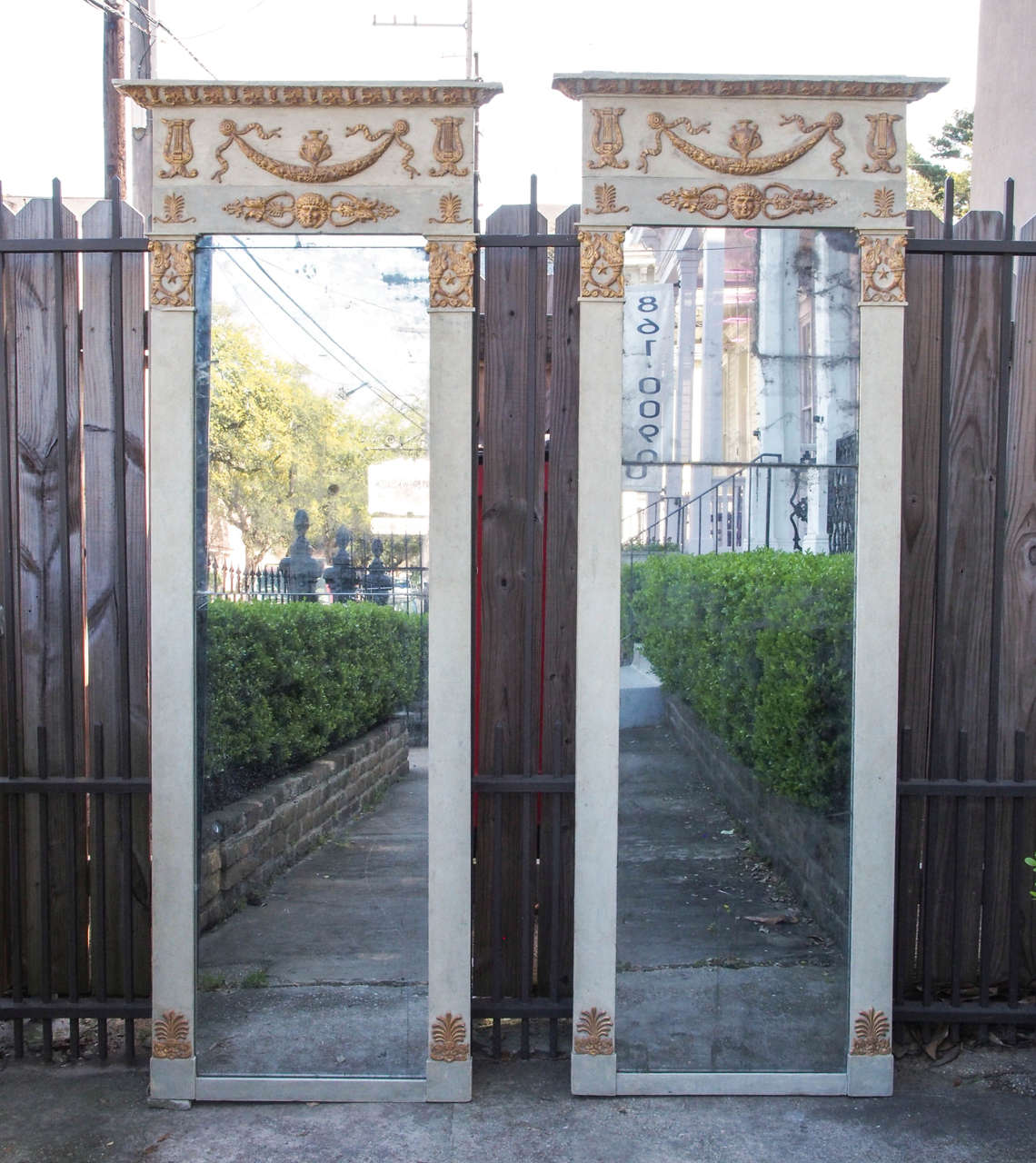 one Period French Empire Painted and Parcel Gilt Tall Looking Glasses.