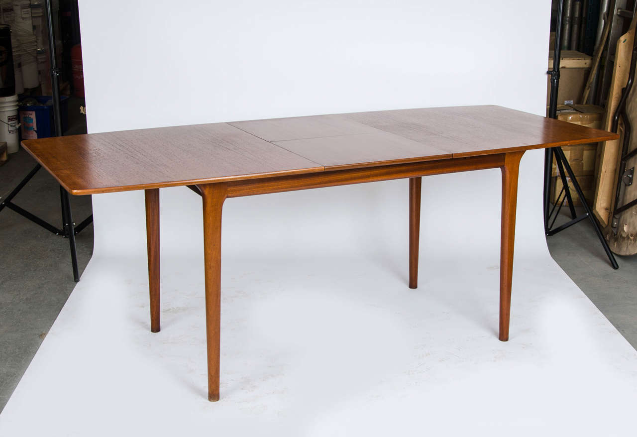 An original McIntosh teak extending dining table with six matching chairs, including two carvers. Chairs recently upholstered in a fresh calico fabric.
Chair Size: 53cm(W) x 46cm(D) x 76cm(H)
Table: 148cm(L) x 80cm(D) x 74cm(H)
Table extends to