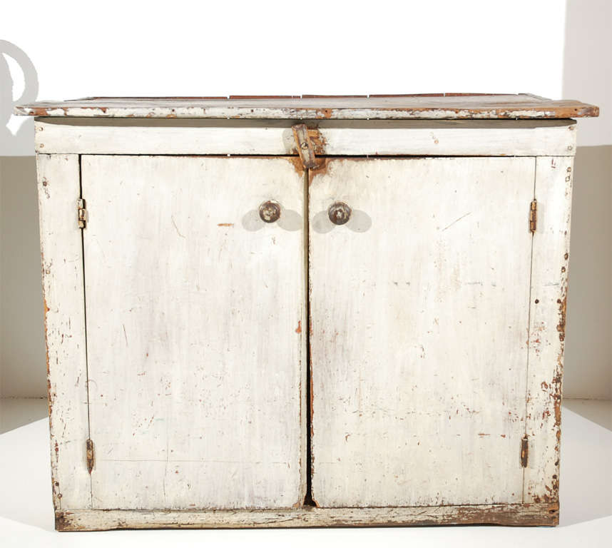 FANTASTIC ORIGINAL PAINTED TWO DOOR 19THC CUPBOARD FROM A FARMHOUSE IN LANCASTER COUNTY, PENNSYLVANIA. WONDERFUL ORIGINAL OLD SURFACE AND SQUARE NAIL CONSTRUCTION.THIS TWO DOOR AND TWO SHELF CUPBOARD HAS GREAT SIMPLE LINES AND GREAT COUNTRY FORM.
