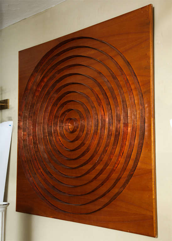 A 1960s abstract wall sculpture handcrafted of wood and copper.