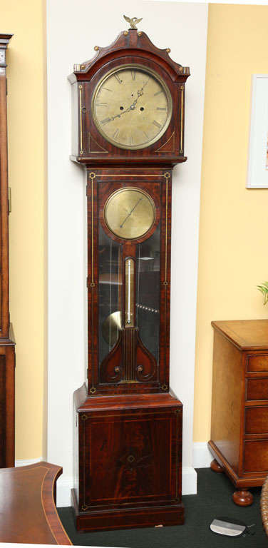 A rare Irish Mahogany and Brass inlayed  tall case clock signed Milton. The clock has A Barometer in Door signed Scott, Dublin. The Clock and Barometer are in working order.