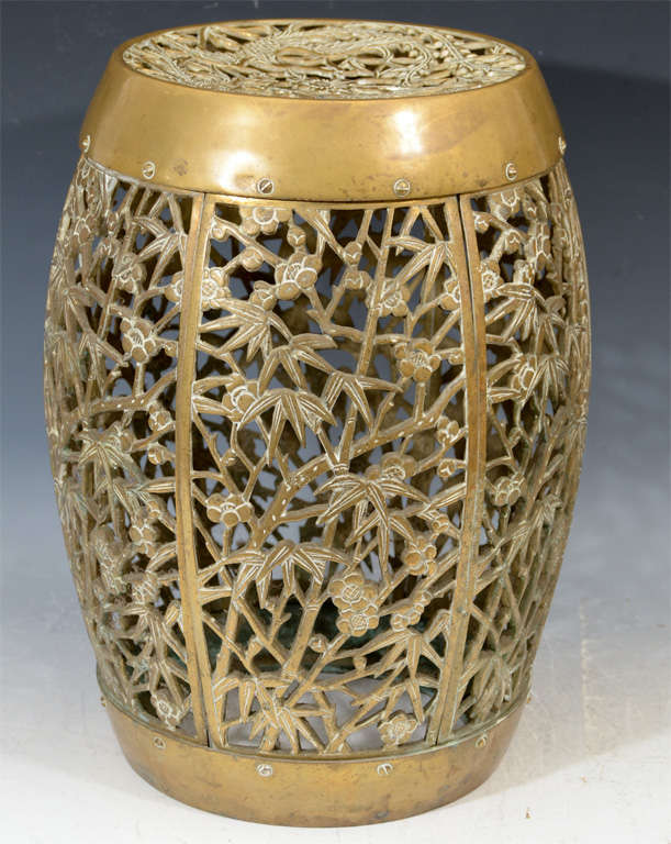 A vintage barrel-form stool or table in bronze with a bird and bamboo motif.