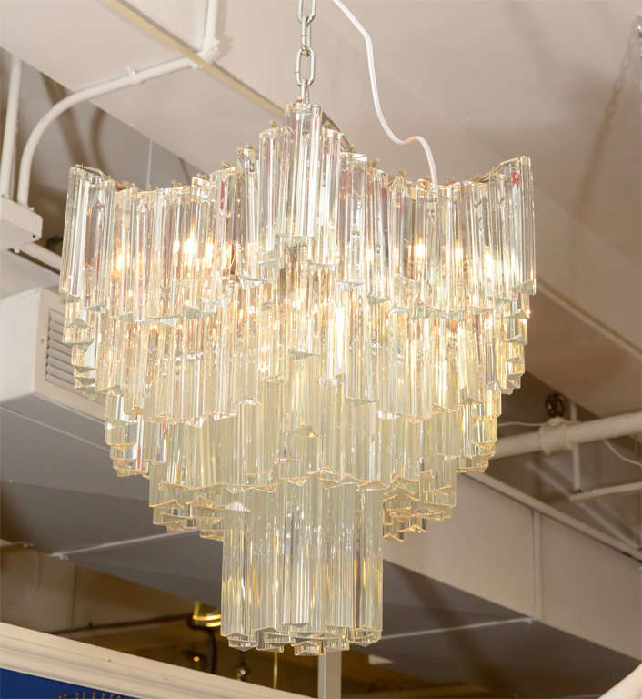 A vintage Italian Murano glass chandelier by Venini composed of clear glass rods in a 