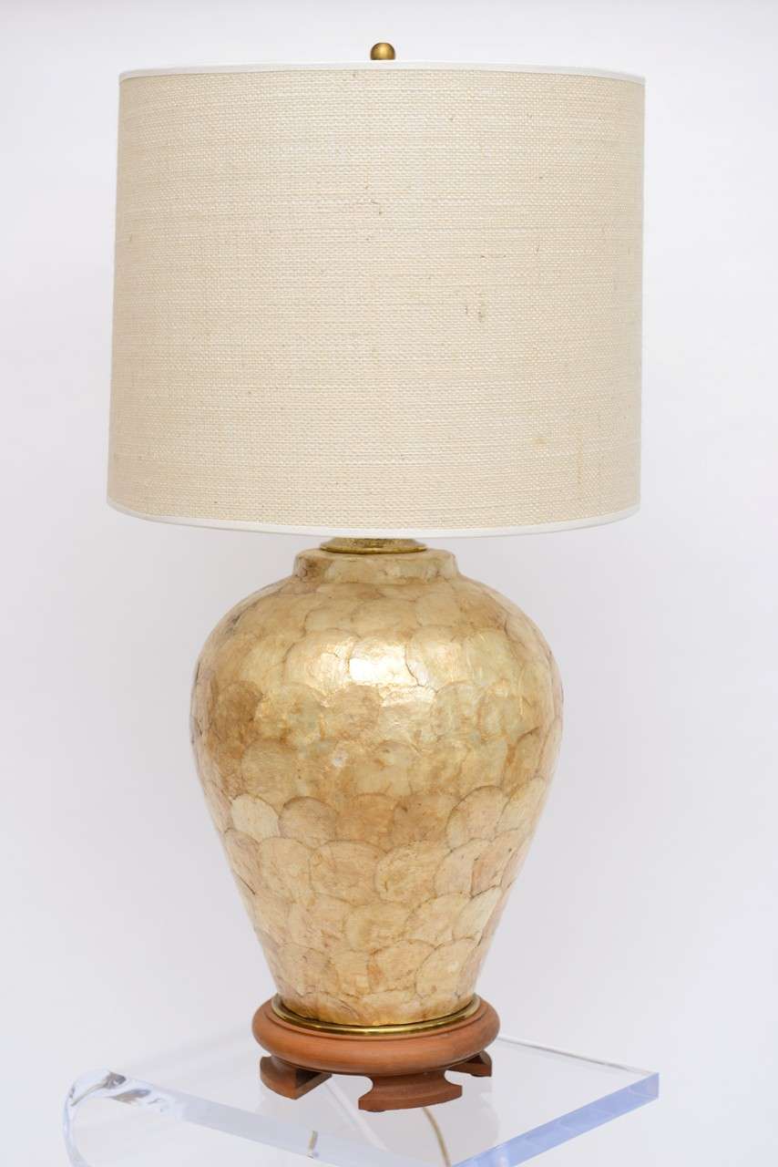 This iridescent lamp is indicative of the Far-East, and screams Asian-inspired.  It is a study of textural, tactile elements throughout;  from the shade to the base, which gives this lamp uniformity, as well as identification.

Starting with the