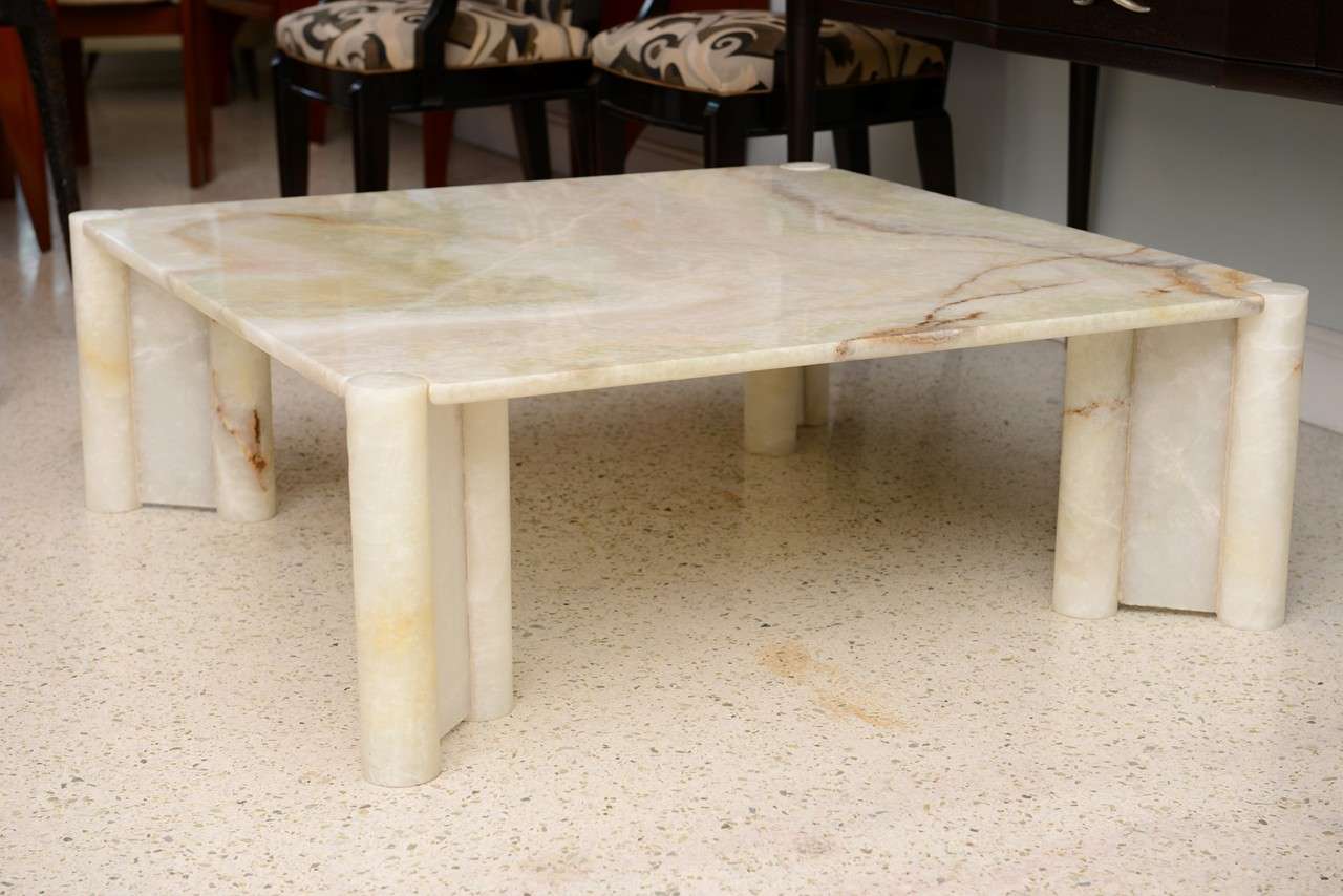 The square onyx top over cylinder legs, rarely used onyx, usually marble.