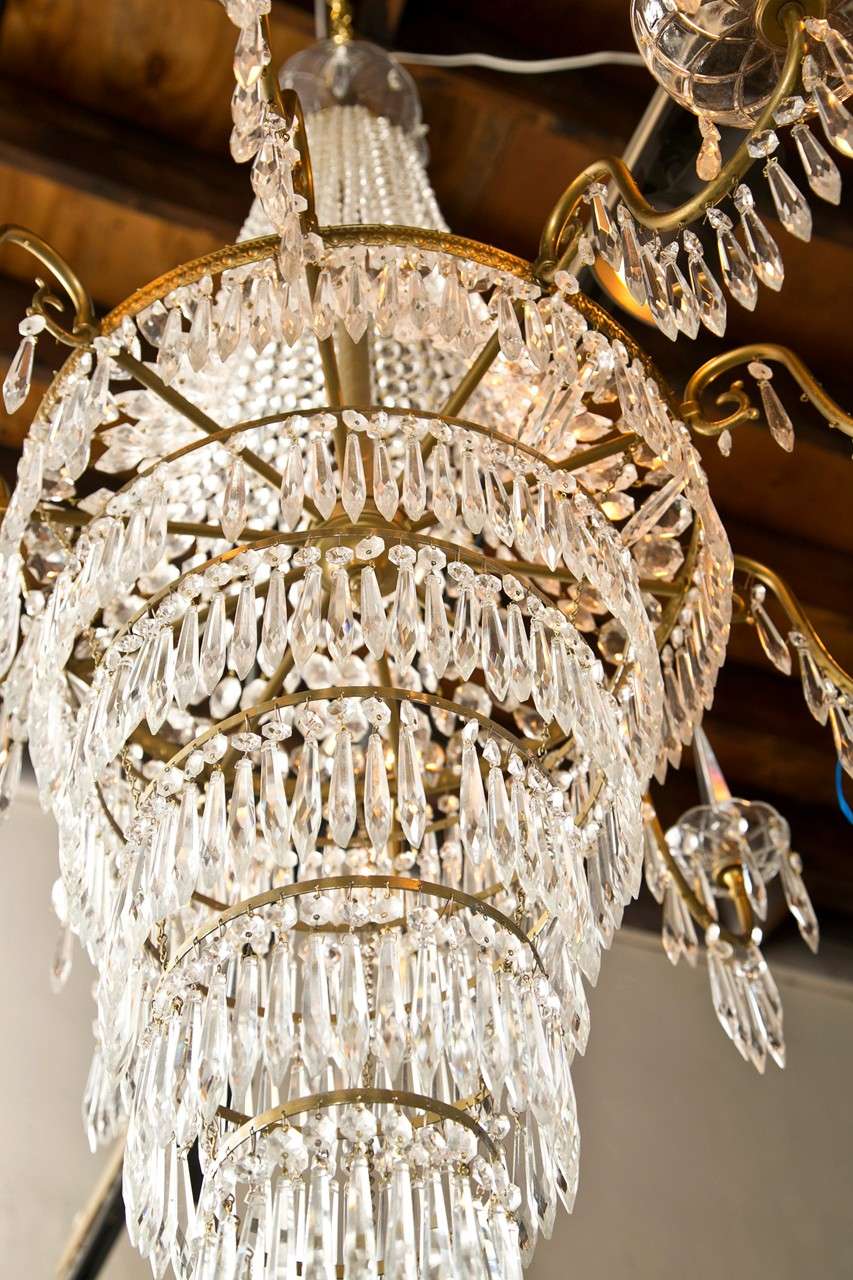 French Empire Style Crystal Chandelier Nine Bronze Arms With Prisms And Bobeches In Good Condition In Stamford, CT