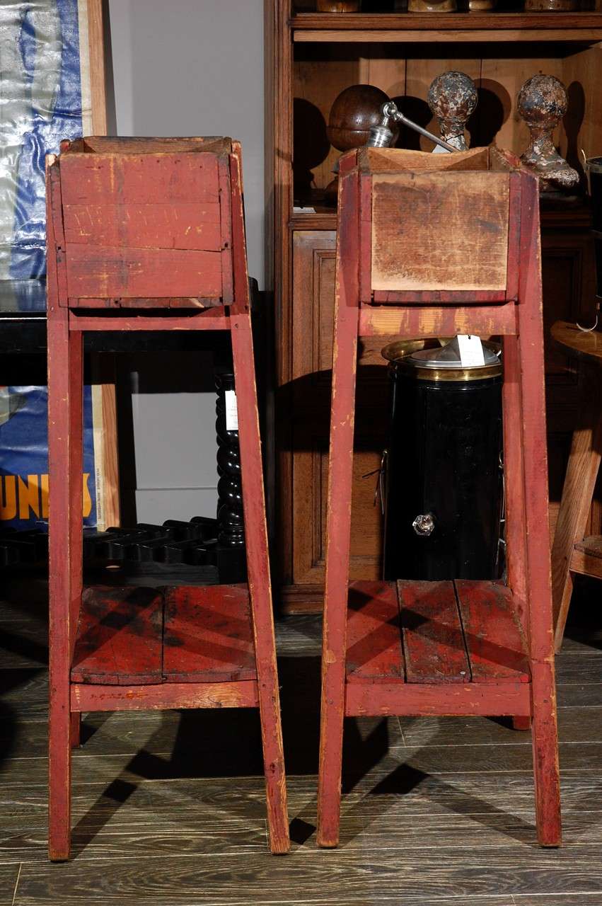 Pair of French country red painted wooden planters on long splayed legs. Serves as a pedestal or plinth.