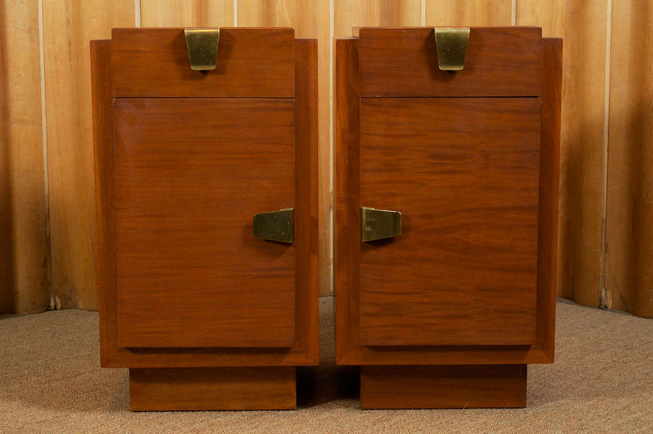 Pair of Art Deco mahogany and brass mounted nightstands with lacquer fitted interiors.