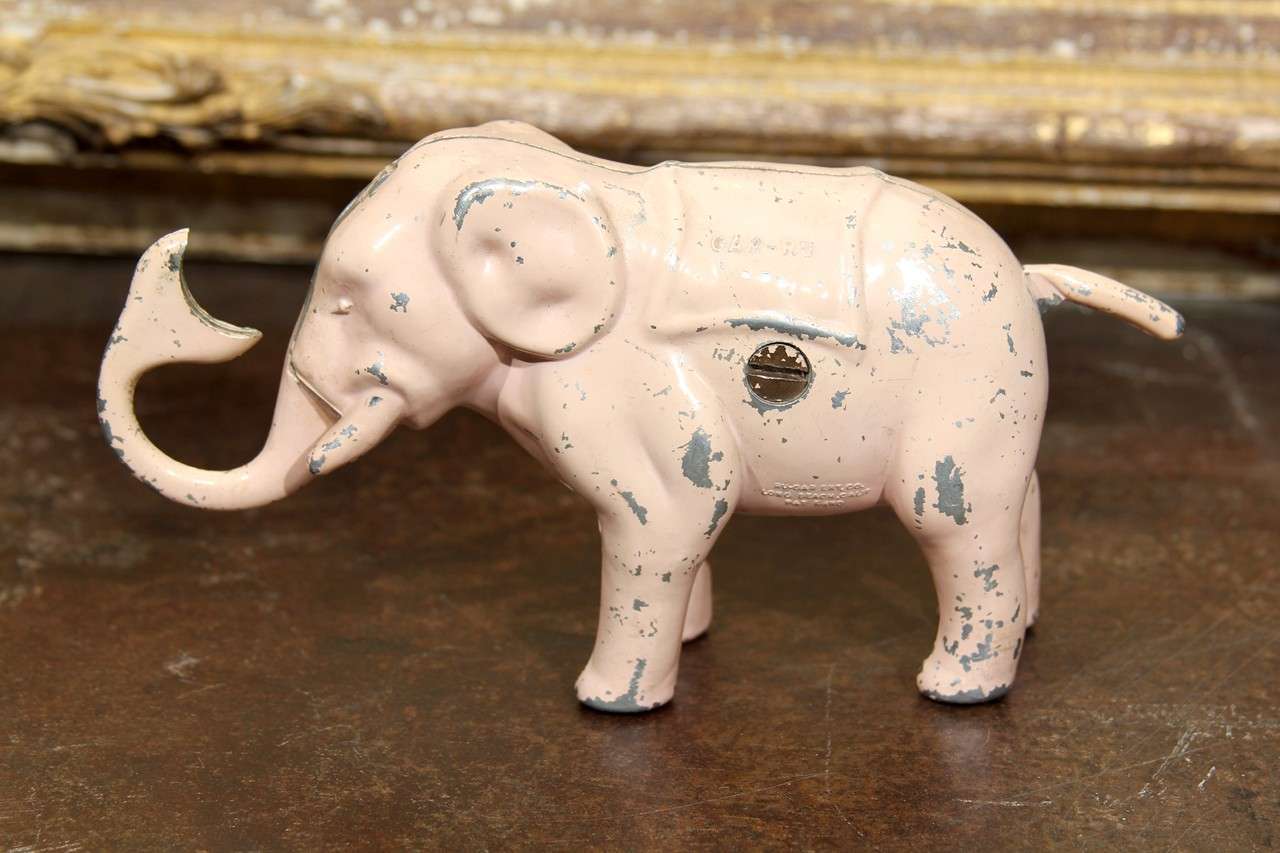 fun pink elephant bank. put coin in trunk, lift tail, voila!   marked GAR-RU