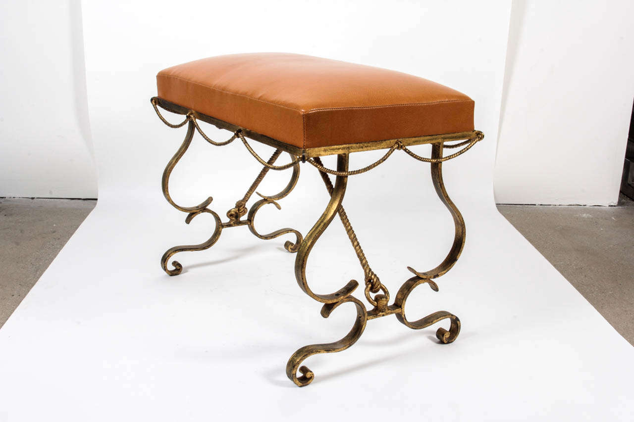 Nice stool in gilt wrought iron, upholstered with leather.