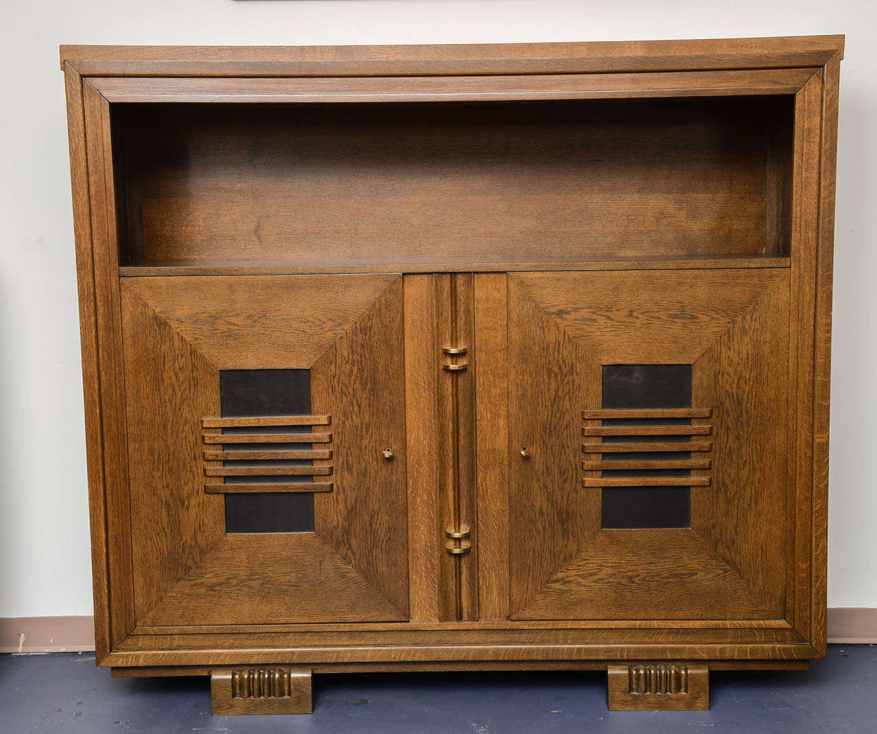 Architectural cabinet designed by Charles DUDOUYT. 
Refined and sophisticated details with geometrical moldings. Very unique and extremely modern conception for this period. Bronze hardwares emphasizing the rigourous lines. High quality golden oak.