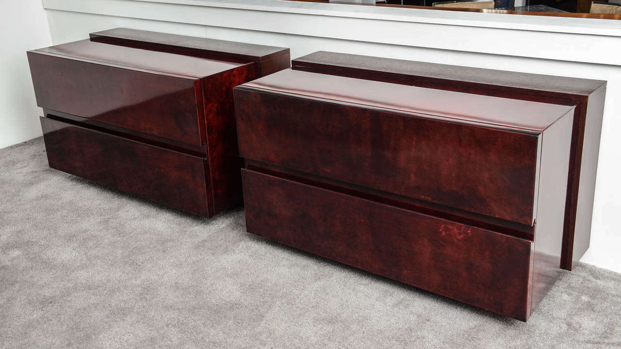 Pair of commodes, night stands or chest of drawers by Aldo Tura. 
Burgundy lacquered goat skin including two long drawers. Very elegant pieces of furniture.